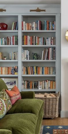 a living room filled with furniture and lots of books