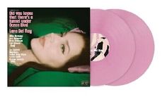 pink vinyl record with an image of a woman's face on the front cover