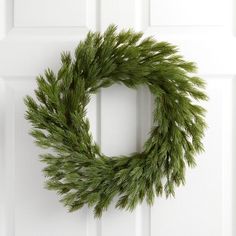 a wreath is hanging on the front door