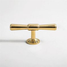 a brass door handle on a white background