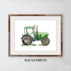 a green tractor with the word mauns prints on it's side in front of a white wall