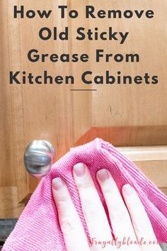 a person wiping up the kitchen cabinets with a pink towel and rag on top of it that says how to remove old sticky grease from kitchen cabinets