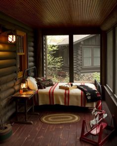 a bedroom with wood flooring and wooden walls