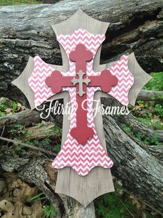 a wooden cross with red and white chevrons