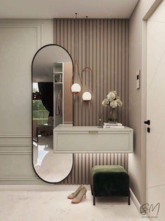 a dressing room with a mirror and stool