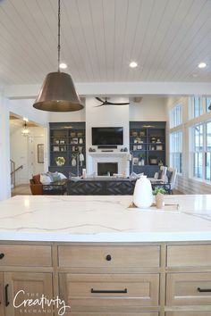 the kitchen is clean and ready to be used as a living room or dining area