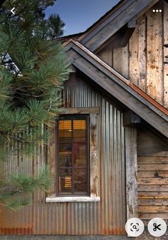 an image of a house made out of metal and wood with the door open to it