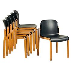 a set of six chairs sitting next to each other