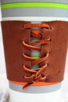 a close up of a coffee cup with laces on the top and bottom side