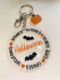 a keychain with the words halloween written on it