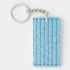 a blue rectangular keychain with water ripples on the front and back sides