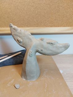 a sculpture of a whale on a table