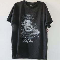 New With Tags Betty Boop Black & Gray Motorcycle Graphic Print 60/40 Cotton/Poly Size L Armpit To Armpit 20.5" Inches Shoulder To Hem 27.5" Inches Size Xl Armpit To Armpit 23.5" Inches Shoulder To Hem 29" Inches Questions? Leave A Comment Below! Y2k Outfits Shirt, Streetwear Fashion Graphic Tee, Off The Shoulder Tee Outfit, Loey Style, Dream Clothes T-shirts & Tank Tops, Baggy Shirts For Women, Baddie Shirts, Heavy Metal Clothes, Gray Motorcycle