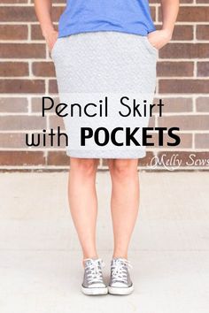 a woman standing in front of a brick wall with the words pencil skirt with pockets