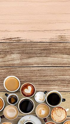 several cups of coffee are arranged in the shape of a heart