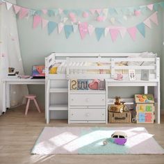 a child's bedroom is decorated in pastel colors and features a white bunk bed