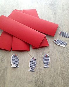 several pieces of red paper laid out on the floor