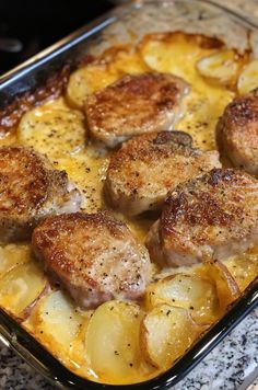 a casserole dish with potatoes and meat in it sitting on a counter top