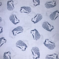 the hedgehogs are drawn on white fabric