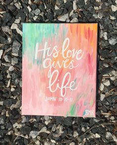 a painting that says, his love gives life john 10 11 - 11 on it