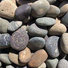 many different colored rocks on top of each other