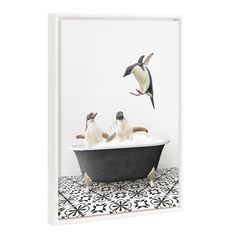 three penguins in a bathtub with one penguin flying over the tub and another bird sitting on top of it