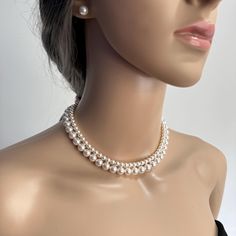 Add a touch of timeless elegance to your jewellery collection with this stunning White Crystal Pearls Choker Necklace with 2 layers of pearls and matching stud earrings.  Materials: 8mm and 5mm Crystal Pearls, Gold plated or Platinum plated brass clasp. The earrings are made with hypoallergenic stainless steel.  Each glossy bead is crafted to mimic the radiant beauty of real pearls, creating a sophisticated and versatile piece. They are luxurious, heavy and cold, just like the real ones. Availab Elegant Round Beads Formal Choker, Elegant Round Beads Choker For Formal Events, Elegant Round Beads Choker For Formal Occasions, Elegant Formal Choker With Round Beads, Classic Pearl Choker For Wedding, Elegant White Choker Jewelry Set, Elegant Single Strand Round Beads Choker, Elegant Double Strand Pearl Embellished Jewelry, Elegant Choker With Round Pearl Beads