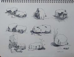 several drawings of rocks in the water and one is drawn on paper with marker pen