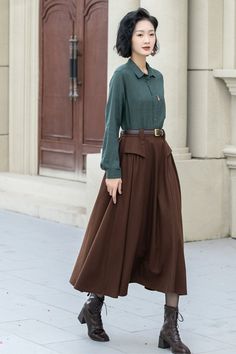 The attention to detail in the construction of this long brown wool skirt is evident in every stitch, show casing the craftsmanship and expertise that went into its creation. With its timeless silhouette and luxurious feel. DETAIL * 50% wool, 50% fiber,nylon, etc. * Fully satiny lining, more nice to the touch body * Two side seam pockets * Elastic waist at back * Long wool skirt * Swing skirt * High waist skirt * Party skirt * For autumn and winter * Belt not for sale * Dry clean only * Lean More about the items From the FAQs on the page bottom MODEL SIZE Bust 85 cm(33.4") Waist 67 cm(26.7") Height 168cm (5' 6") She wears size XS Choose CUSTOM Order if you * Need a better fit * Can't find your size in our size Chart * Change the Style * Chang the Length * Your Height is not Between 5'1" - Winter Belt, Custom Skirt, Long Wool Skirt, Long Brown Skirt, Skirt Winter, Skirt A Line, Plus Size Skirt, Brown Skirts, Winter Skirt