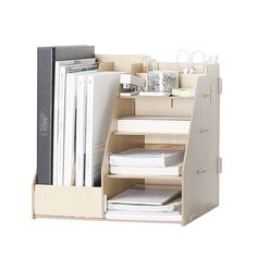 a wooden desk organizer with books, magazines and files in it on a white background