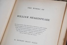 the works of william shakespeare written in black and white on an open book with writing underneath it