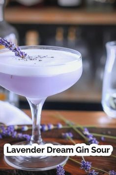 lavender dream drink in a martini glass with the words lavender dream gin sour