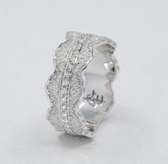 a white gold ring with diamonds on it