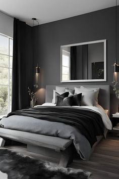 a bedroom with black and white bedding, gray walls and wooden floors is shown