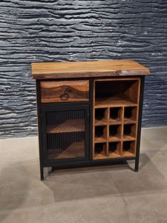 a wooden and metal cabinet with wine bottles in it