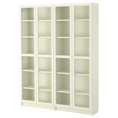 a white bookcase with four shelves on the front and two doors in the back