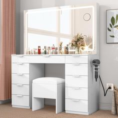 a white vanity with drawers and stool in a room next to a large mirror on the wall