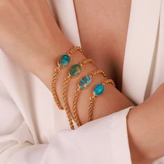 ▶ 𝙋𝙍𝙊𝘿𝙐𝘾𝙏 𝙁𝙀𝘼𝙏𝙐𝙍𝙀𝙎 * 14k Yellow Gold Bracelet * Chain Bracelet Width: 3.50mm * Stone Size : 16mm x 12.00mm OVAL * Chain Color: Yellow Gold ✔️ Made of real turquoise stone. Since turquoise stone is made of natural stone, there may be differences in the colors of the stone. (Because raw stone) ❤️Indulge in the timeless elegance of our Gold Turquoise Oval Bracelet. Handcrafted with love and precision, this exquisite piece features a genuine, natural turquoise stone that is beautifull Turquoise Bracelet Gold, Stone Aesthetic, Real Turquoise Jewelry, Oval Bracelet, Christmas Gift Handmade, Natural Turquoise Stone, Real Turquoise, Handmade Fine Jewelry, Bracelet Chain