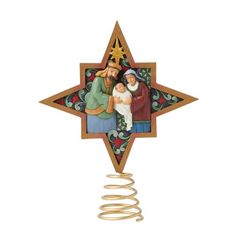 a christmas ornament with an image of three people holding a baby in the center