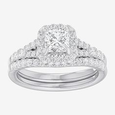 an engagement ring set with a princess cut diamond in the center