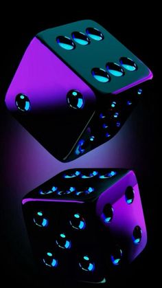 two purple and black dices are in the dark