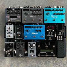 several different types of pedals and amps are arranged on top of each other