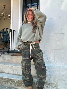 Model wears size small; runs true to size Designed in camo twill jogger pants, box pocket detailing, button & strap on waist. 100% cotton Camo Pants Outfit Women, Camo Joggers Outfit Women, Camo Joggers Outfit, Camouflage Pants Outfit, Camp Pants Outfit, Joggers Outfit Women, Green Cargo Pants Outfit, Parachute Pants Outfit, Camo Pants Outfit