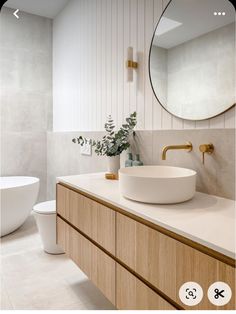 a bathroom with a sink, mirror and toilet