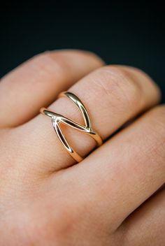 This beautiful 14kt gold-fill wrapped ring will become a staple in your wardrobe. This ring is handcrafted out of a D-shaped (half round) metal. Two ends connect at the center of the ring create a branch-like design. This ring is whimsical, classic and infinitely stylish. Please note, this listing if for ONE single ring in 14K Gold-fill. + Available In Silver (sold separately): https://www.etsy.com/listing/240271360/silver-branch-ring-sterling-silver + View More Stacking Rings: https://www.etsy. Gold Wrap Ring, Criss Cross Ring, Minimal Ring, Branch Ring, Single Ring, Bold Rings, Gold Wrap, Gold Ring Stack, Cross Ring