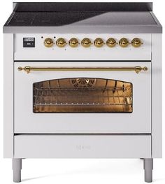 a white oven with gold knobs on the front and side doors, sitting against a white background