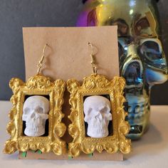 Hand-sculpted and hand-painted spooky skull in picture frame earrings! This statement accessory is so funky and spooky and would be the most ghoulish addition to your outfit! Perfect for this Halloween season! These are made to order and handmade, so please note that there may be some slight variations. Thank you! I hope you like them! Stay funky! Picture Frame Earrings, Skull Pictures, Halloween Season, Polymer Clay Earrings, Clay Earrings, Picture Frames, Polymer Clay, Jewelry Earrings Dangle, Etsy Earrings