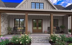 the front porch of a house with flowers and chairs