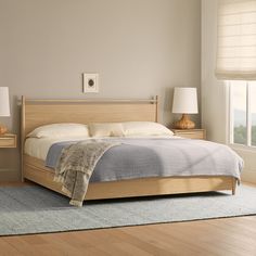 a bedroom with a bed and two nightstands