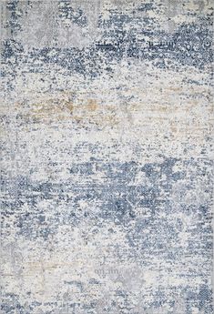 an area rug with various colors and patterns on the carpet, including blue, beige, grey